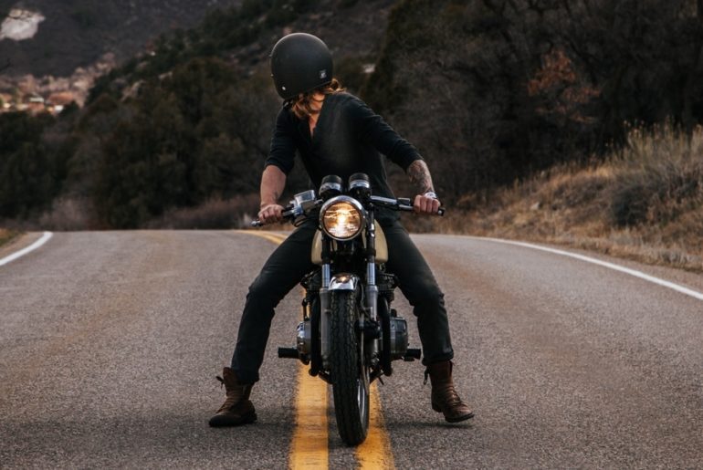 Man on Motorcycle Looking Backward